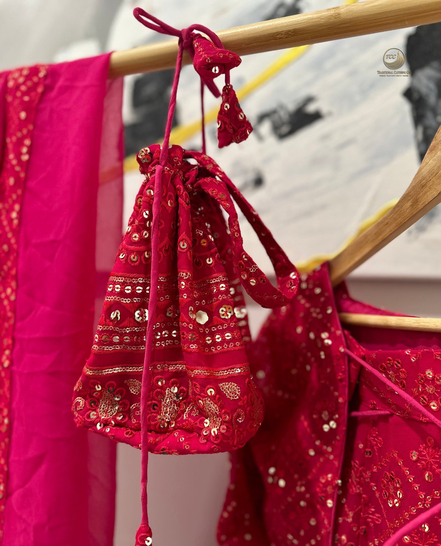 Elegant Red Embroidered Lehenga Choli with Dupatta & Matching Potli Bag – Bridal & Festive Wear
