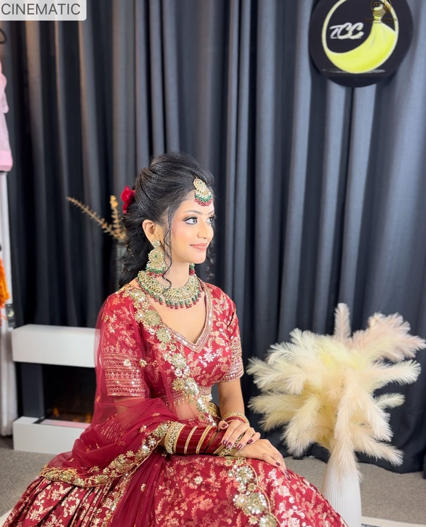 RED BRIDAL THREAD AND SEQUIN EMBROIDERED LEHENGA WITH BOUTIQUE BLOUSE, SEQUIN EMBROIDERED DUPATTA AND MATCHING POTLI