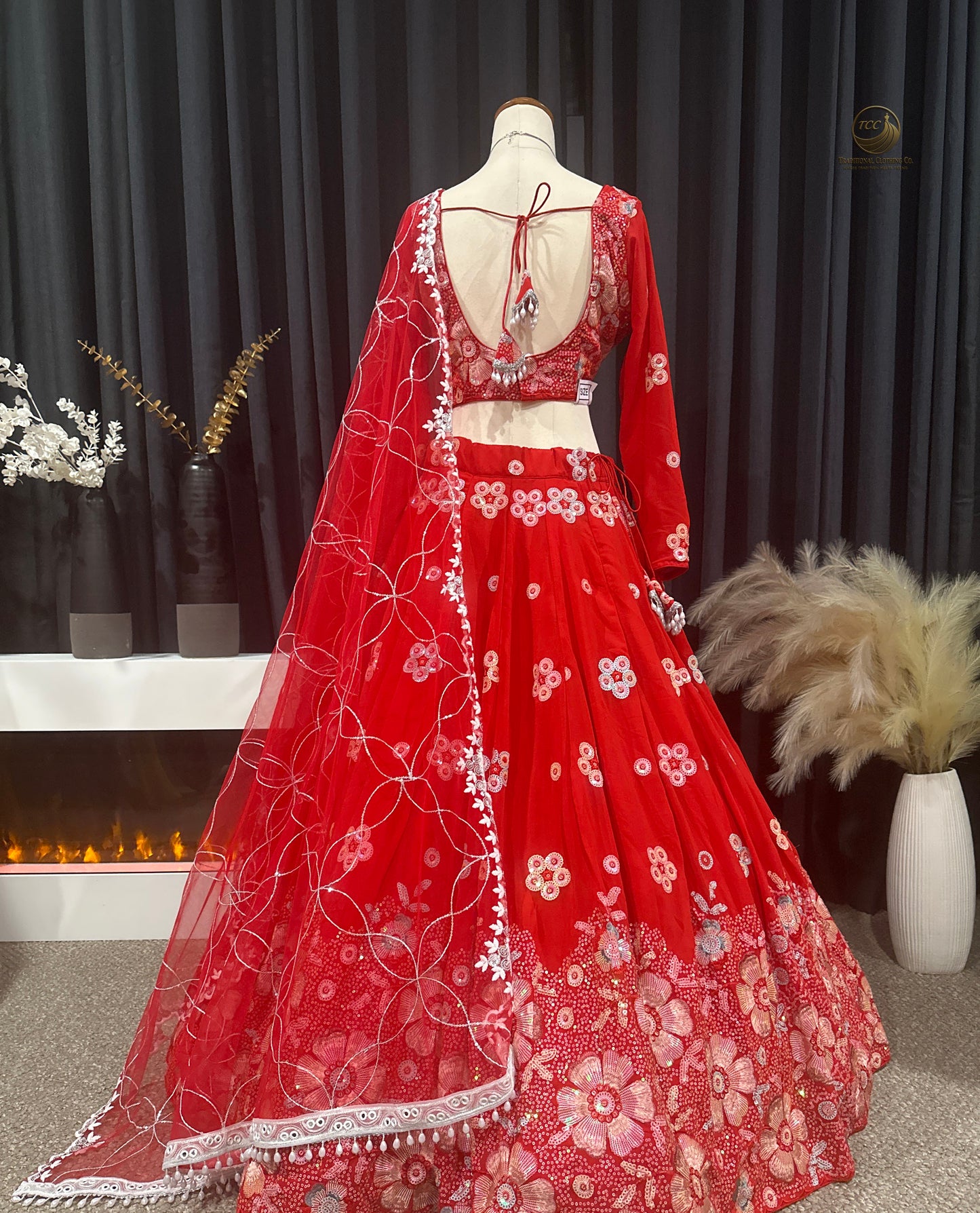 RED BRIDAL THREAD AND SEQUIN EMBROIDERED LEHENGA WITH BOUTIQUE BLOUSE, SEQUIN EMBROIDERED DUPATTA AND MATCHING POTLI