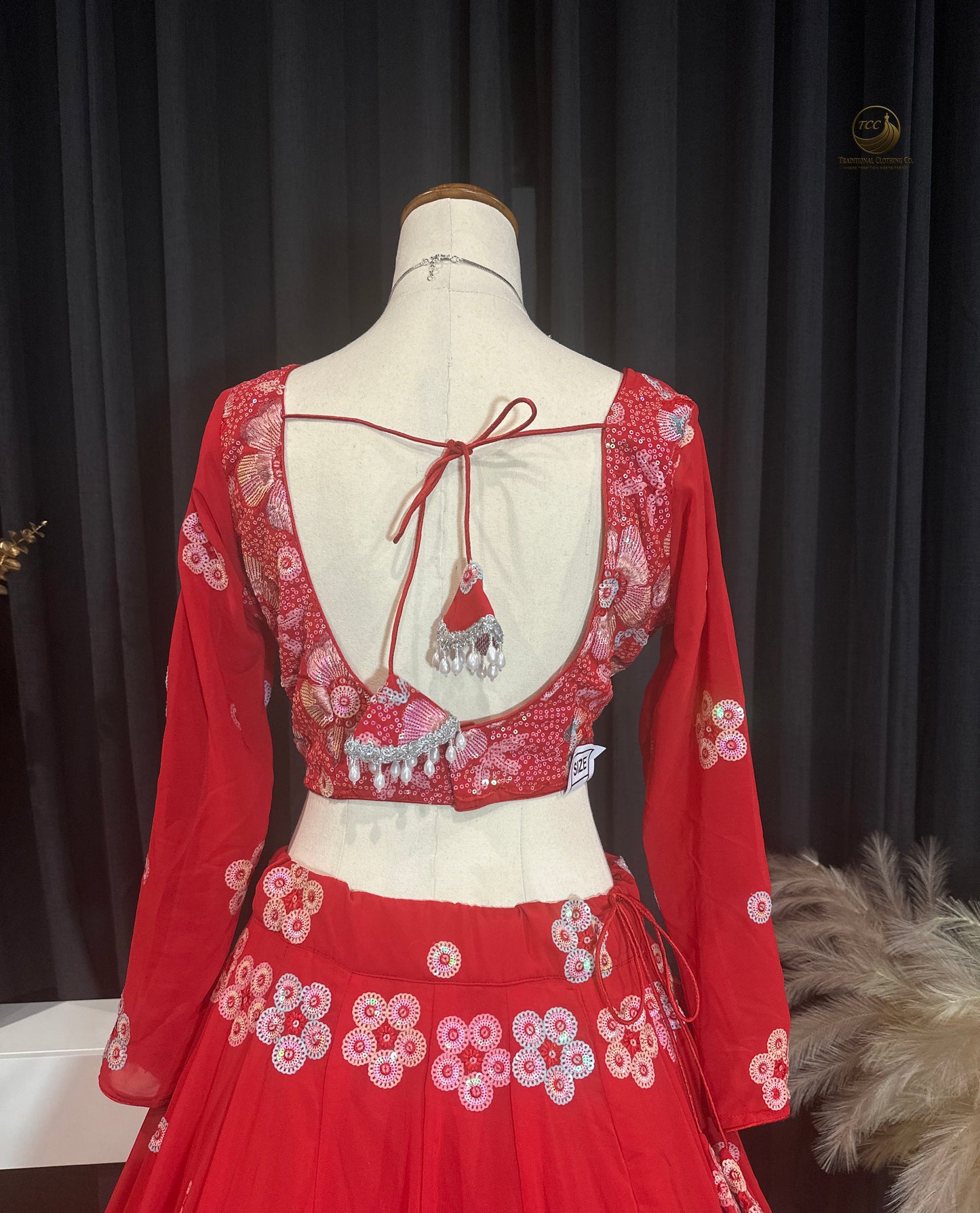 RED BRIDAL THREAD AND SEQUIN EMBROIDERED LEHENGA WITH BOUTIQUE BLOUSE, SEQUIN EMBROIDERED DUPATTA AND MATCHING POTLI