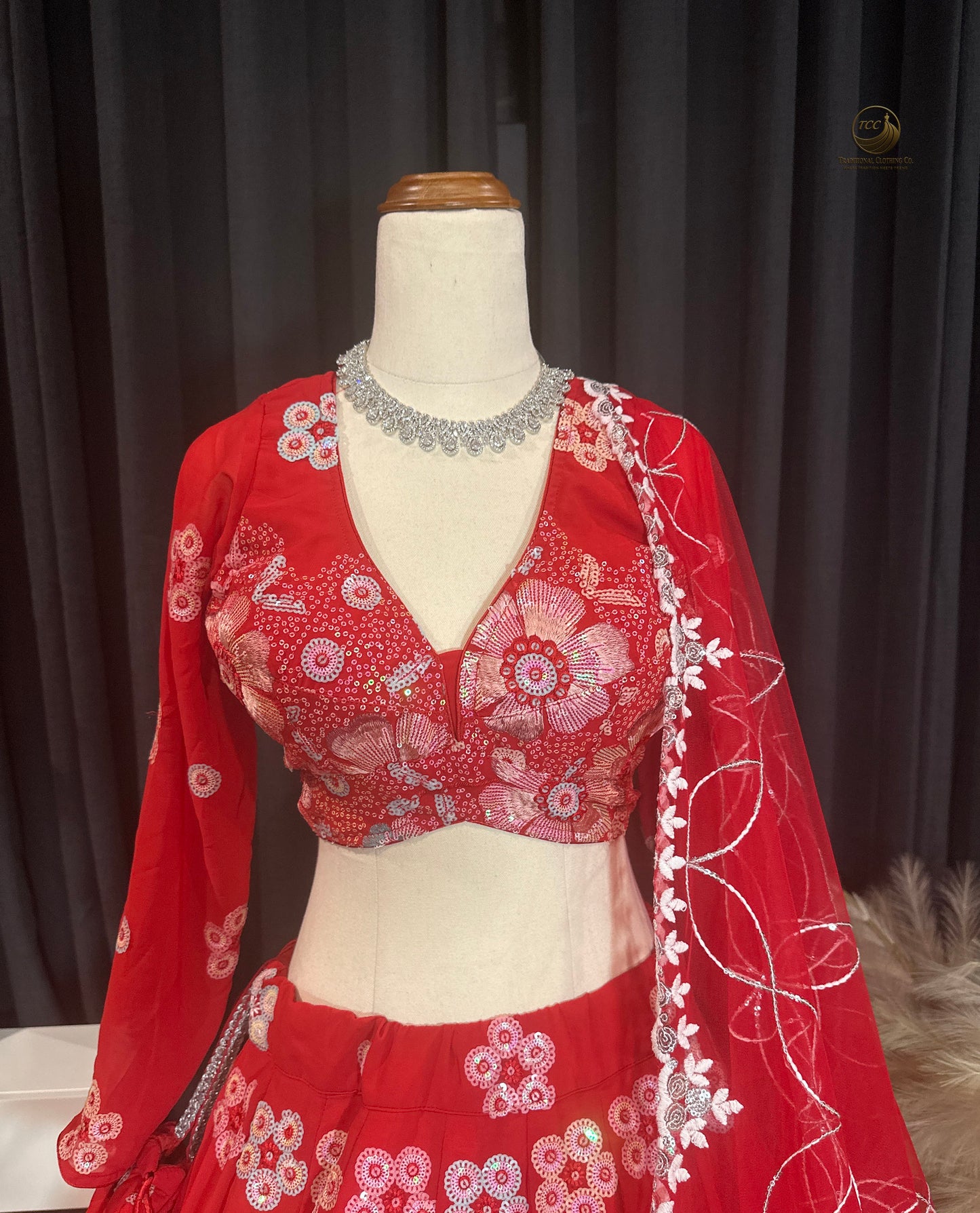RED BRIDAL THREAD AND SEQUIN EMBROIDERED LEHENGA WITH BOUTIQUE BLOUSE, SEQUIN EMBROIDERED DUPATTA AND MATCHING POTLI