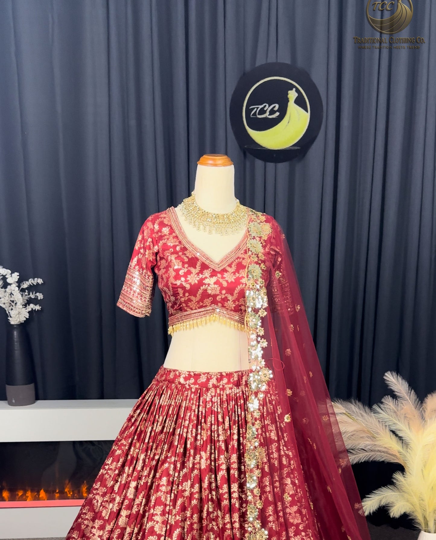 RED BRIDAL THREAD AND SEQUIN EMBROIDERED LEHENGA WITH BOUTIQUE BLOUSE, SEQUIN EMBROIDERED DUPATTA AND MATCHING POTLI
