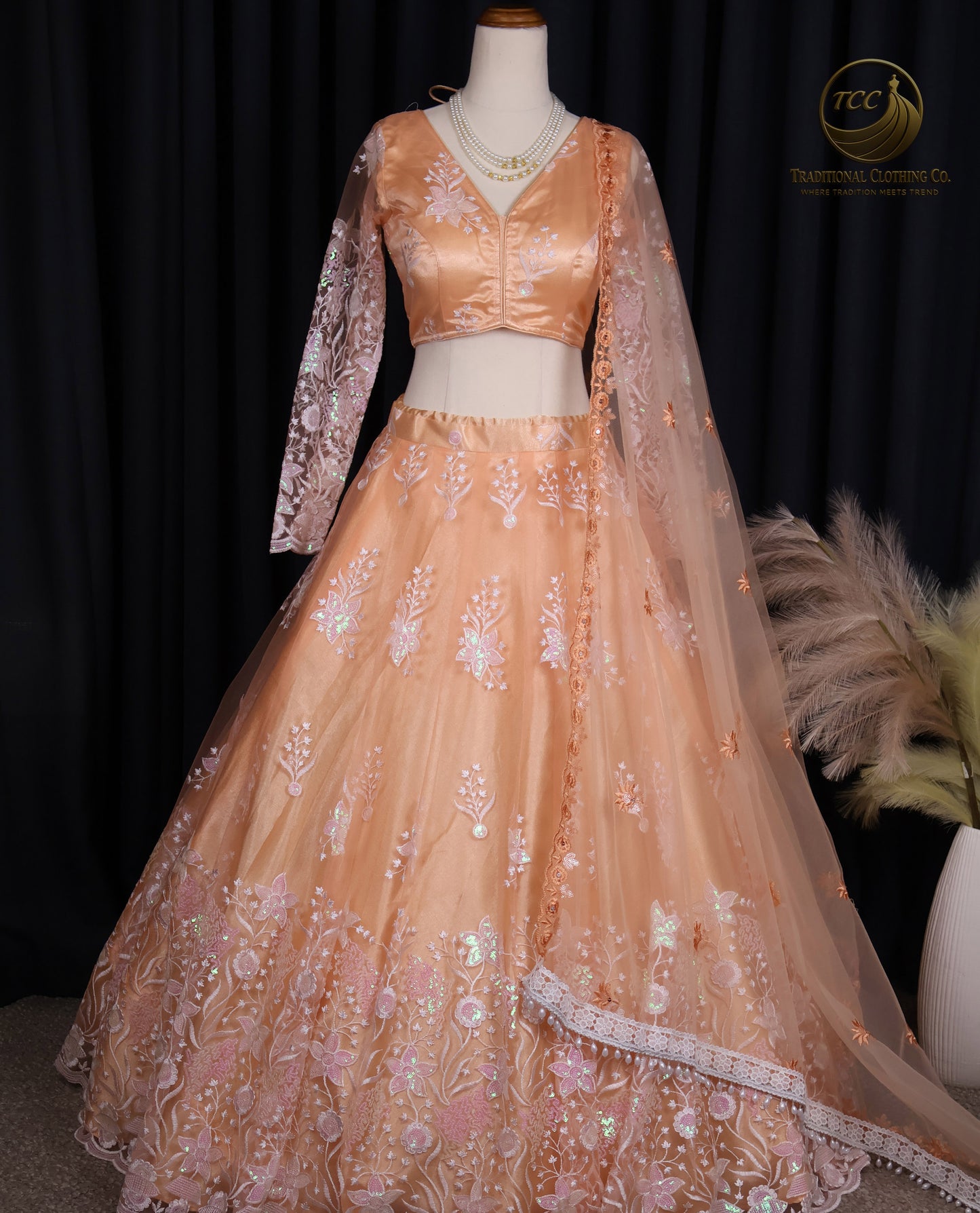 Elegant Peach Embroidered Lehenga Choli with Tassel Tie-Up Back & Sheer Dupatta – Festive & Traditional Wear