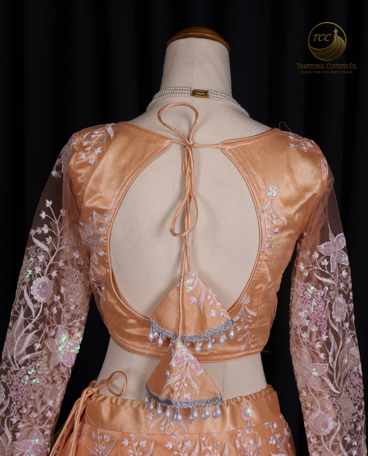 Elegant Peach Embroidered Lehenga Choli with Tassel Tie-Up Back & Sheer Dupatta – Festive & Traditional Wear
