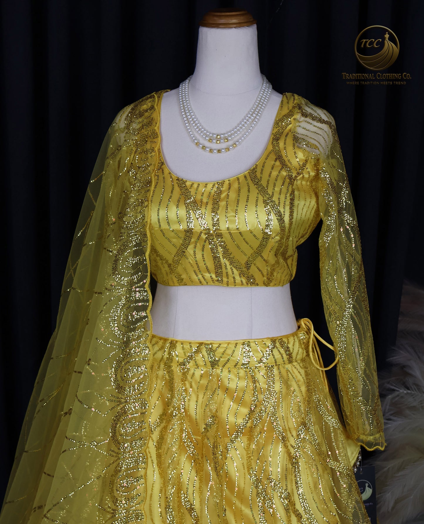 Radiant Yellow Embroidered Lehenga Choli – Open Back & Tassel Tie