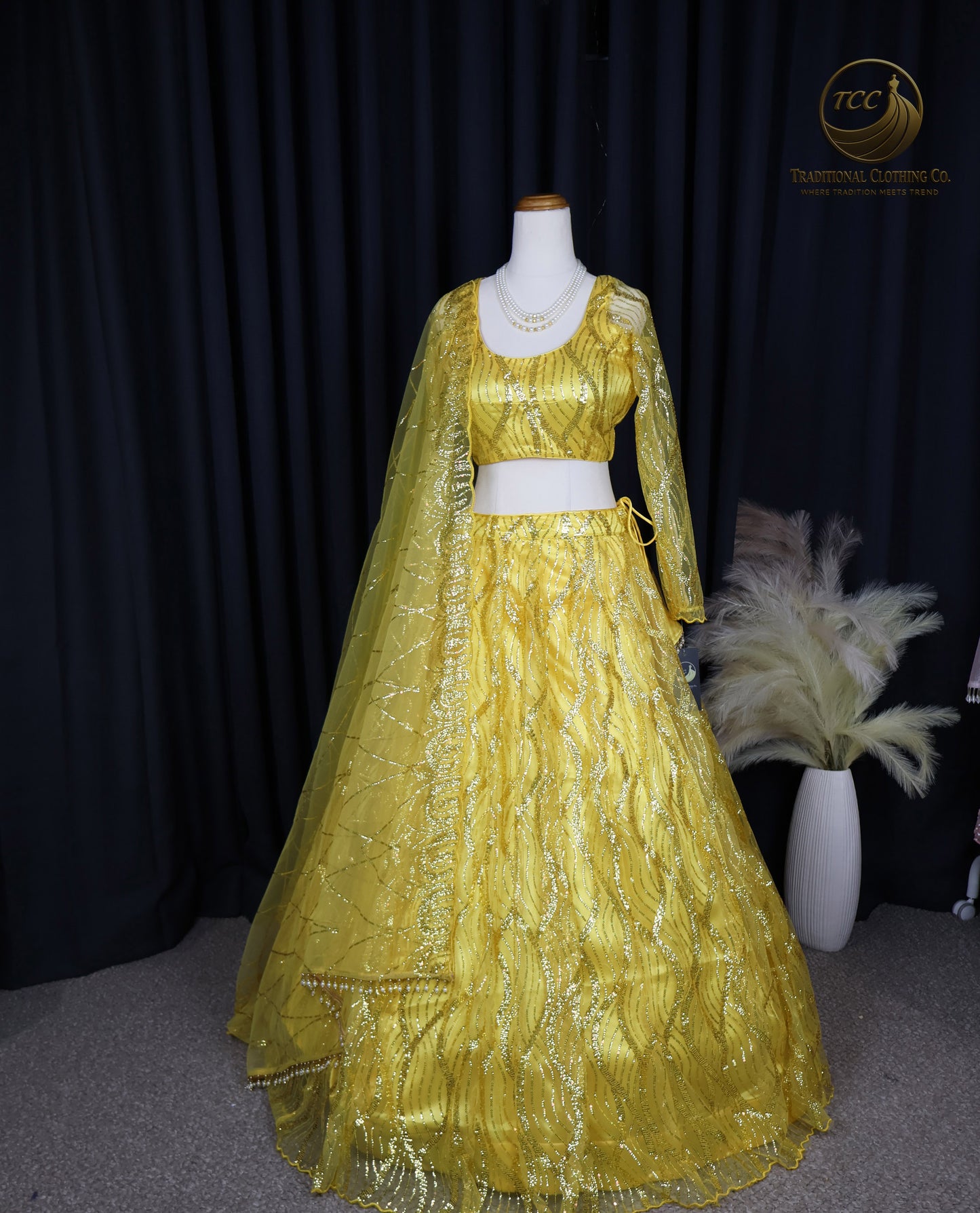 Radiant Yellow Embroidered Lehenga Choli – Open Back & Tassel Tie
