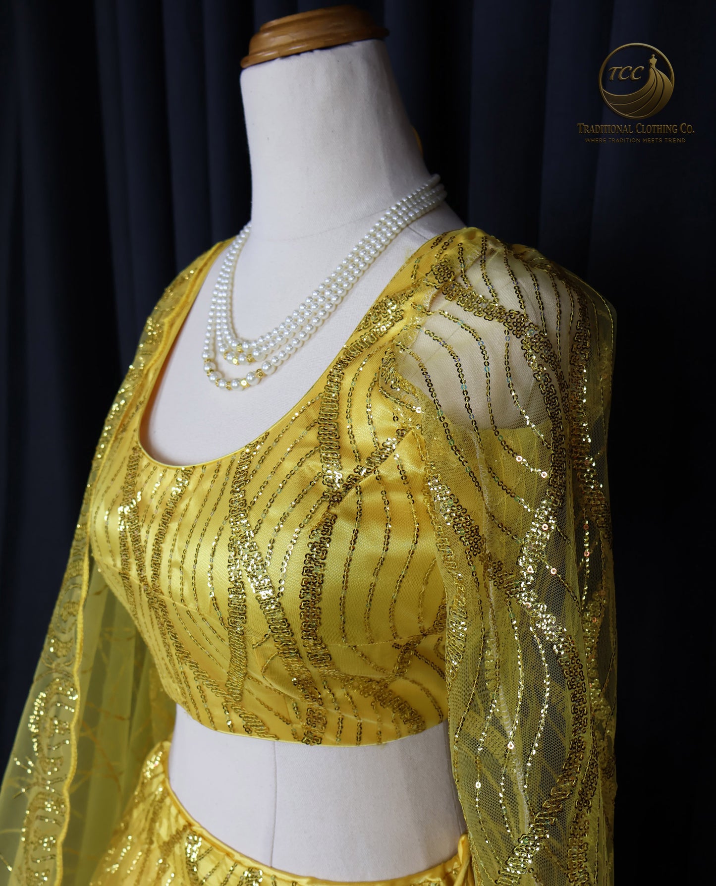 Radiant Yellow Embroidered Lehenga Choli – Open Back & Tassel Tie