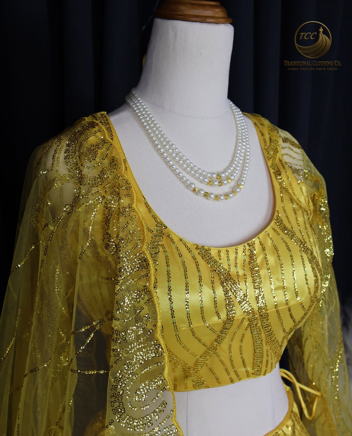 Radiant Yellow Embroidered Lehenga Choli – Open Back & Tassel Tie