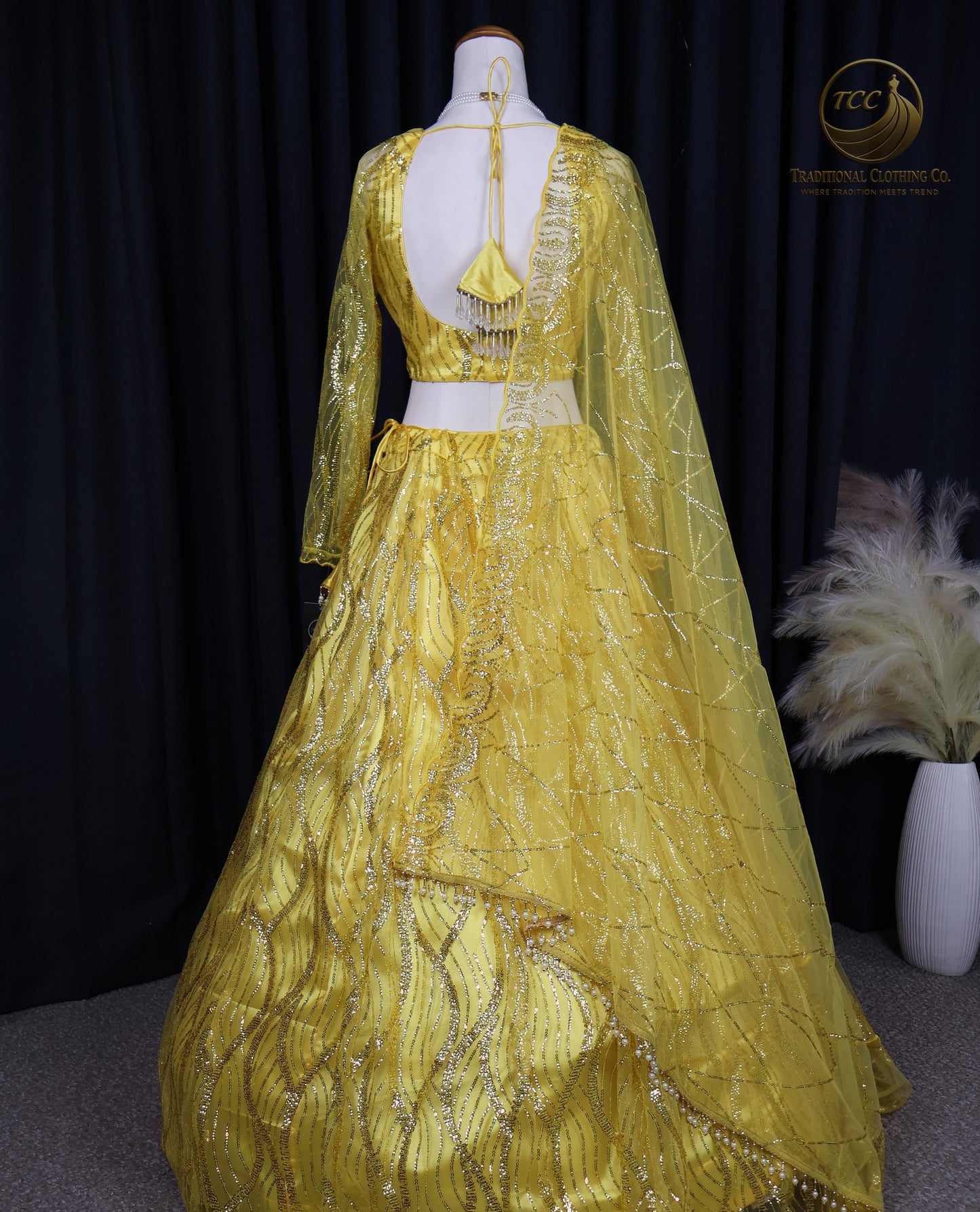 Radiant Yellow Embroidered Lehenga Choli – Open Back & Tassel Tie