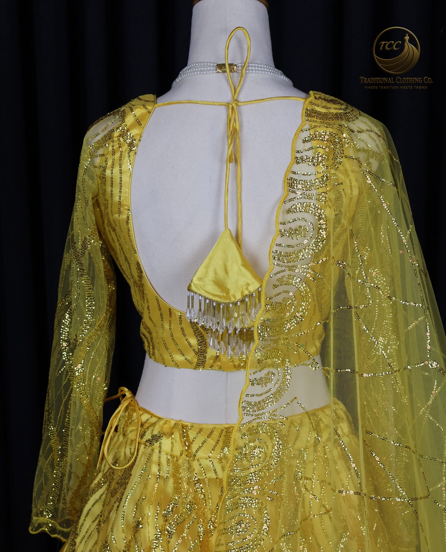Radiant Yellow Embroidered Lehenga Choli – Open Back & Tassel Tie