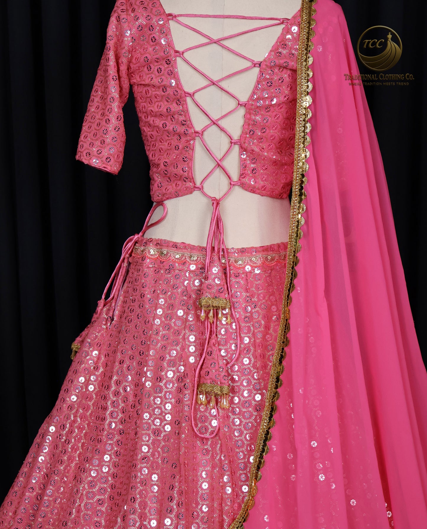 Stunning Light Coral Pink Embroidered Lehenga Choli with Crisscross Lace-Up Back & Sheer Dupatta – Festive & Traditional Wear