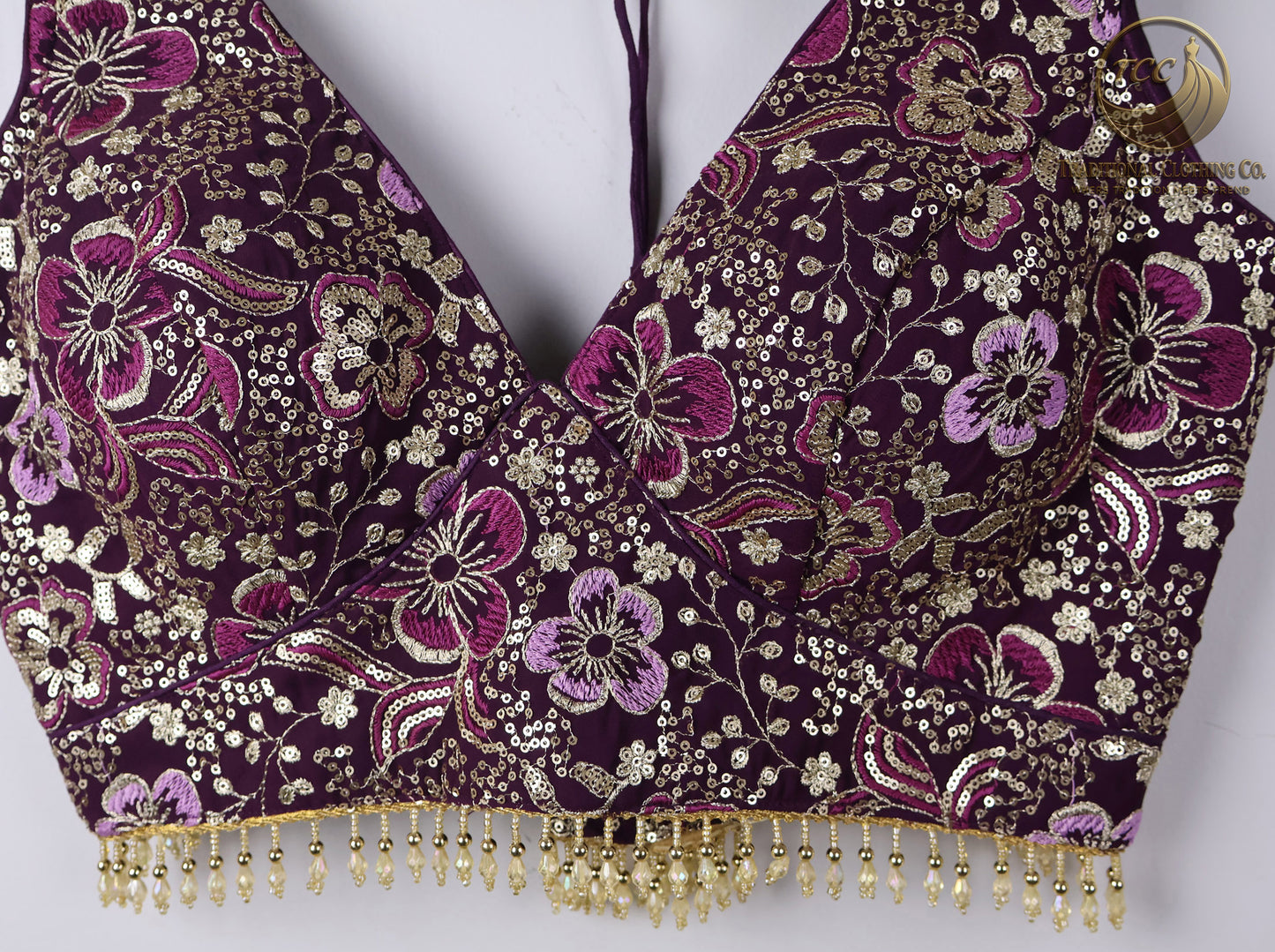 Deep Purple Embroidered Choli with Tassel Tie Closure & Beaded Hem – Modern Blouse for Festive & Cultural Wear | Boutique Edition