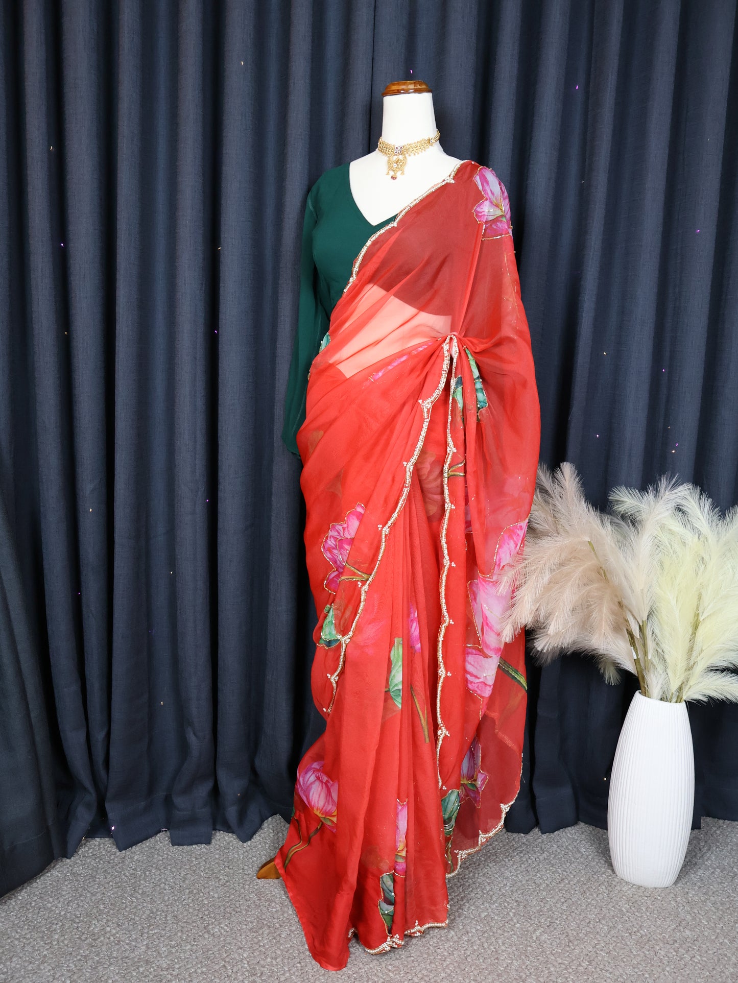 Green blouse and red saree