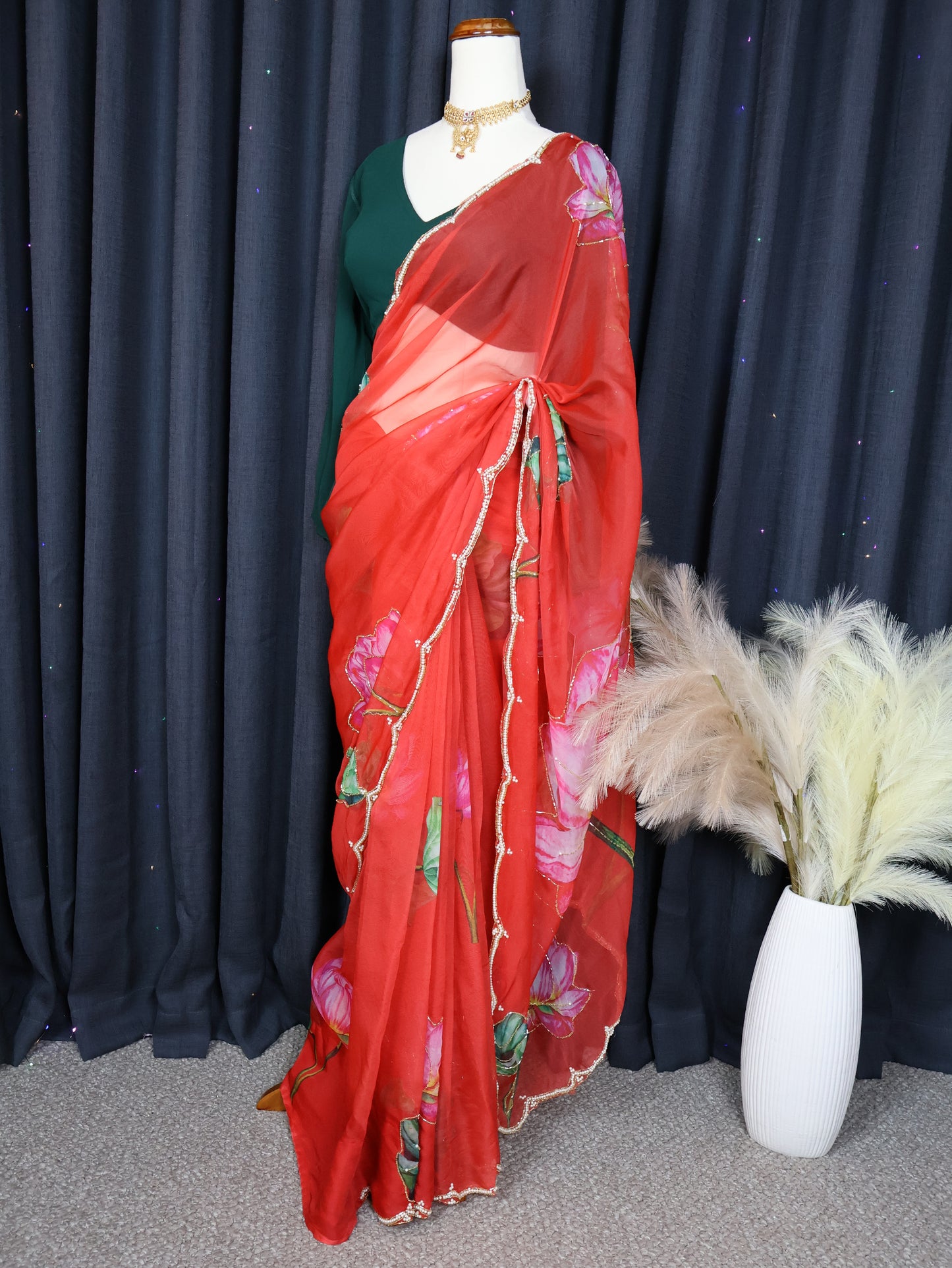 Green blouse and red saree