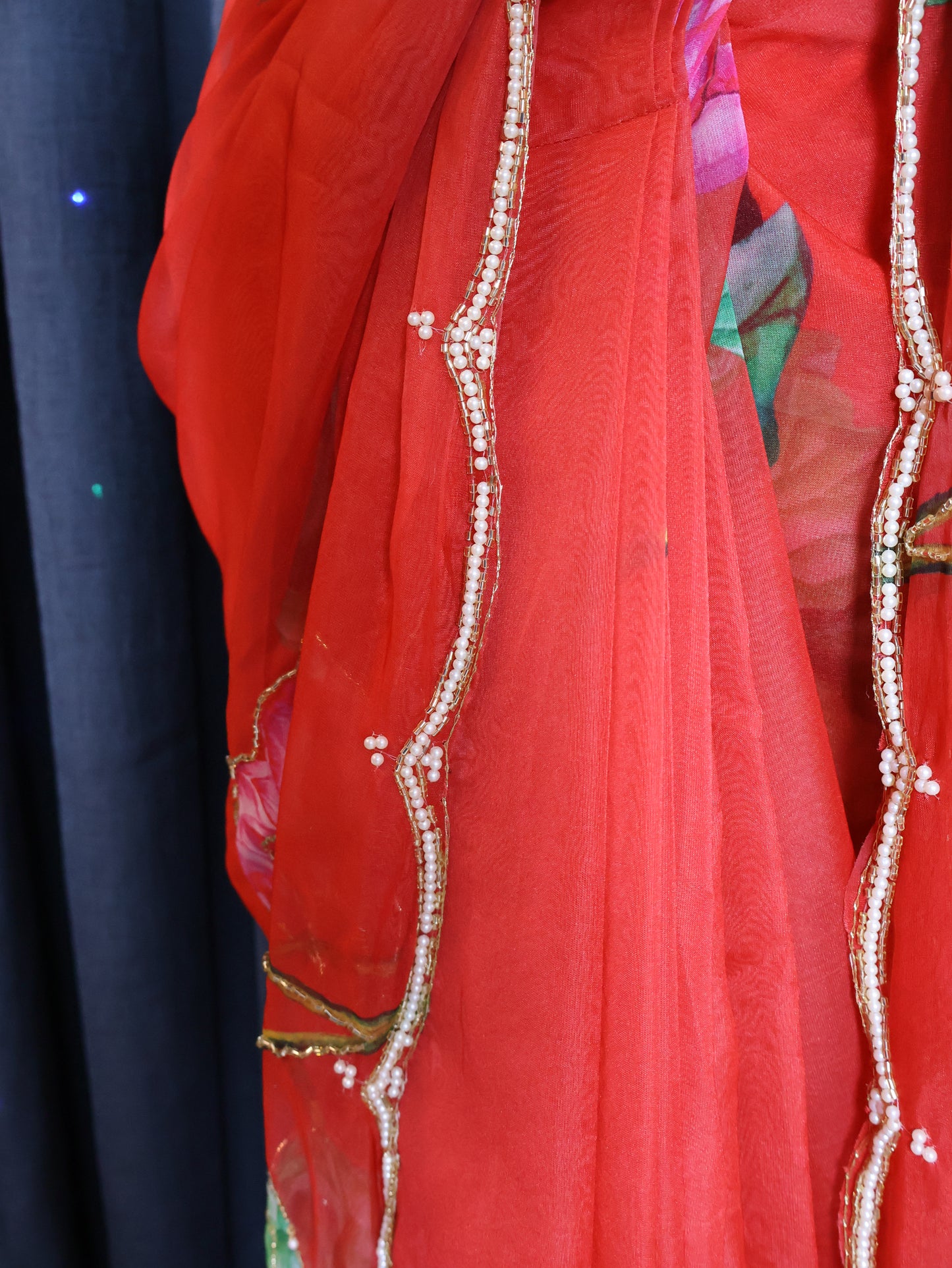 Green blouse and red saree