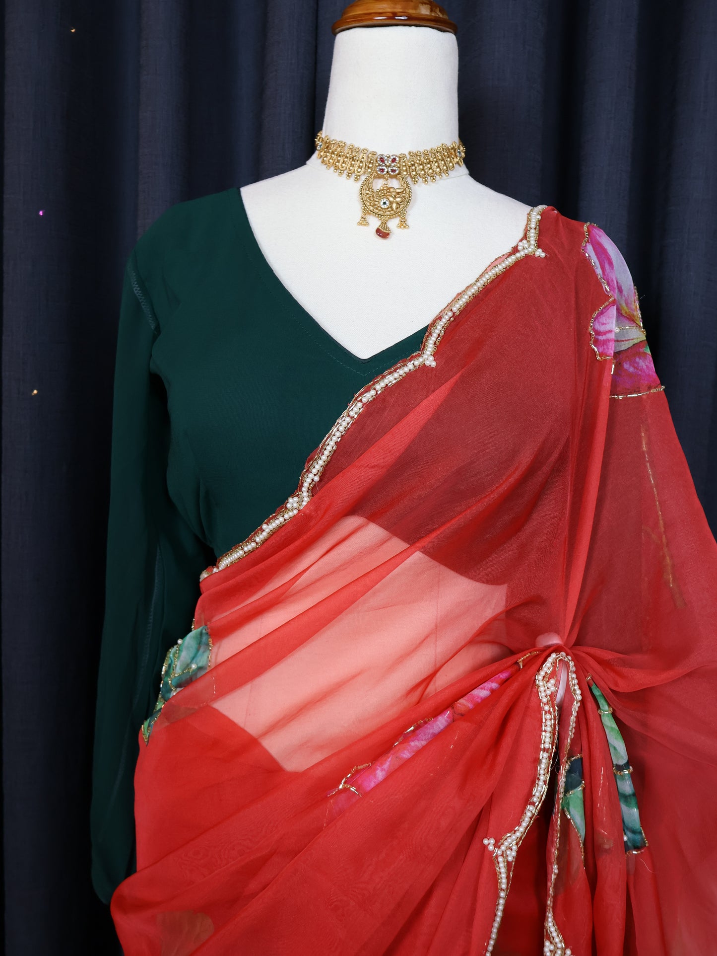 Green blouse and red saree
