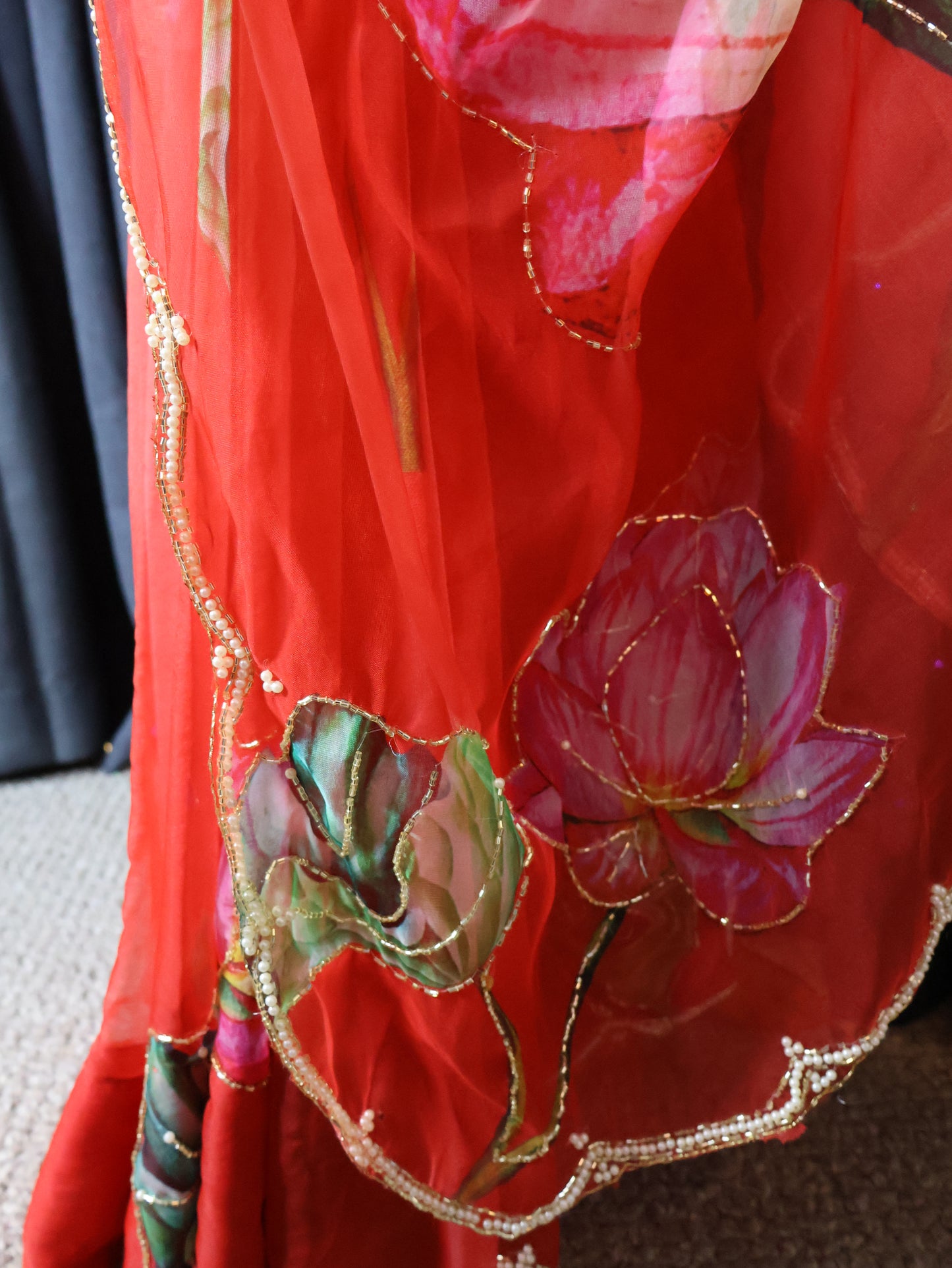 Green blouse and red saree