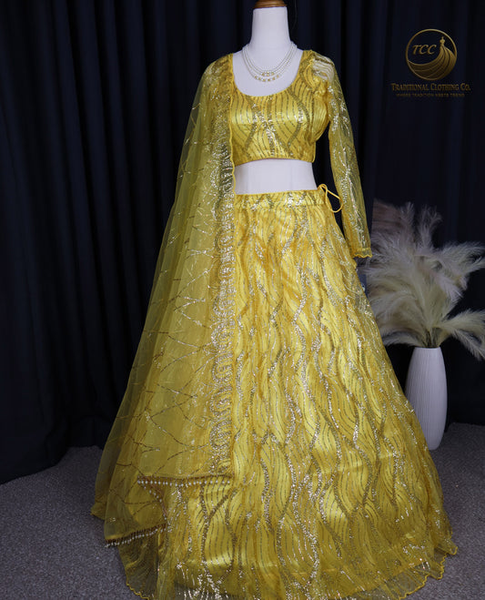 Radiant Yellow Embroidered Lehenga Choli – Open Back & Tassel Tie