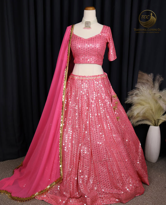 Stunning Light Coral Pink Embroidered Lehenga Choli with Crisscross Lace-Up Back & Sheer Dupatta – Festive & Traditional Wear